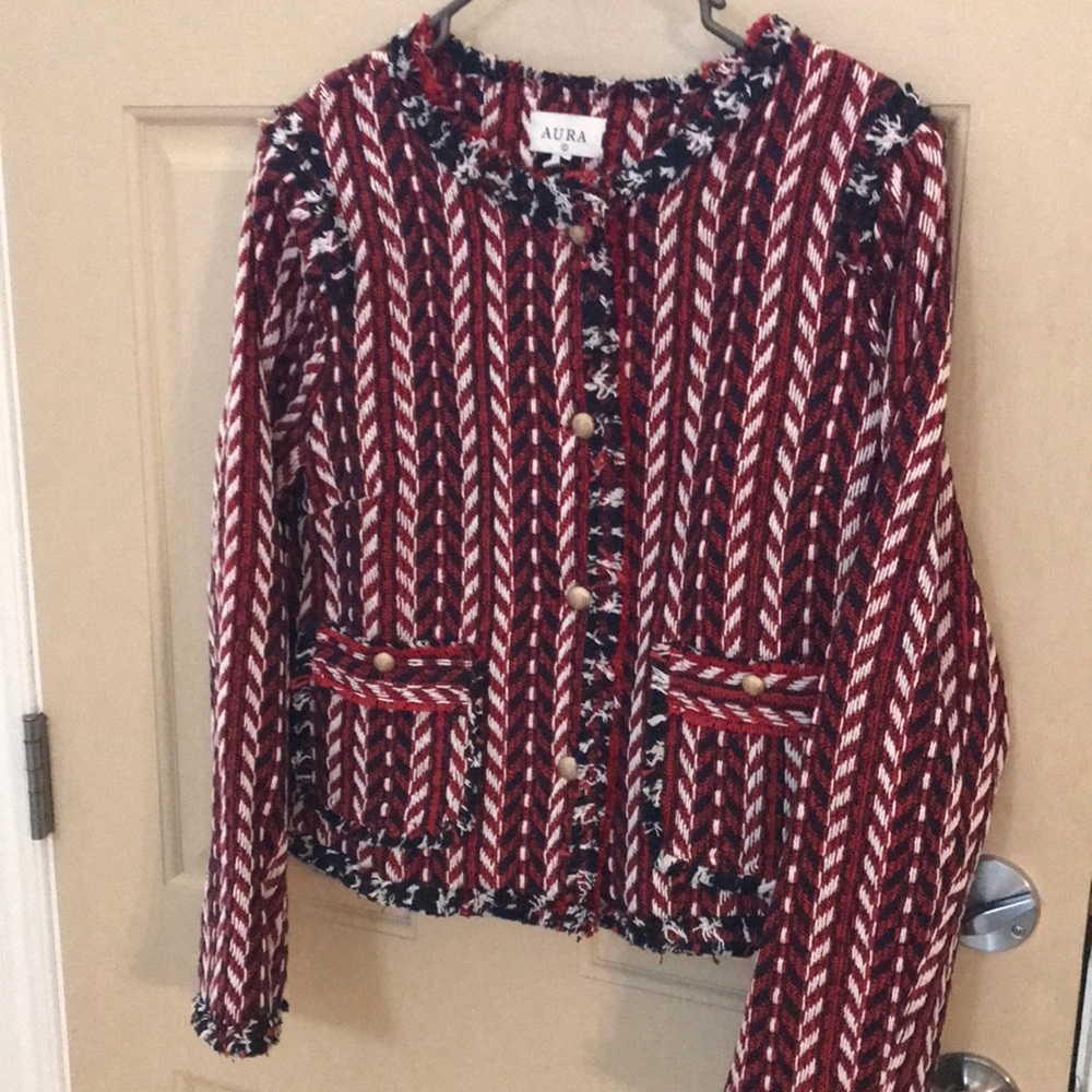 Gorgeous women’s jacket. Size Large. New without tags. Never worn. Black/Red.
